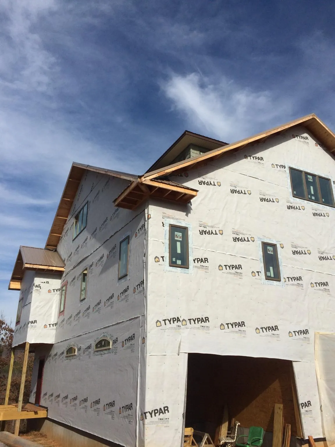 Stick built house wrapped in Typar with new roof framing and dormers in Belvidere